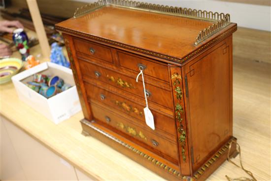 A painted miniature satinwood Wellington chest length 43cm